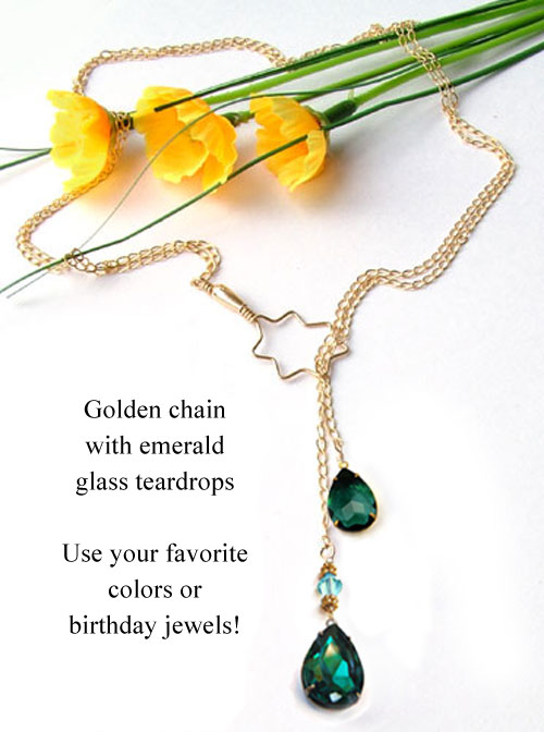 lariat necklace design idea featuring golden chain and emerald glass teardrops
