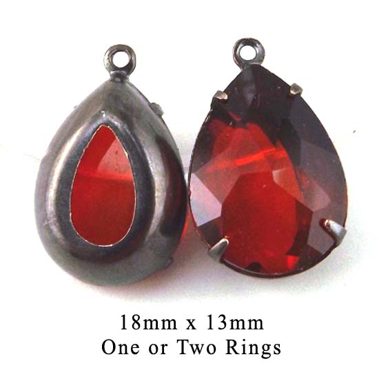 red glass jewels in black brass settings